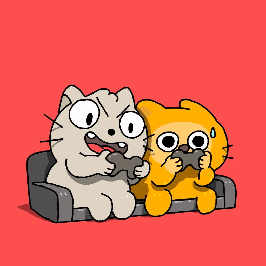 a pair of cats playing video games